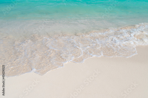 Wave on white sand beach