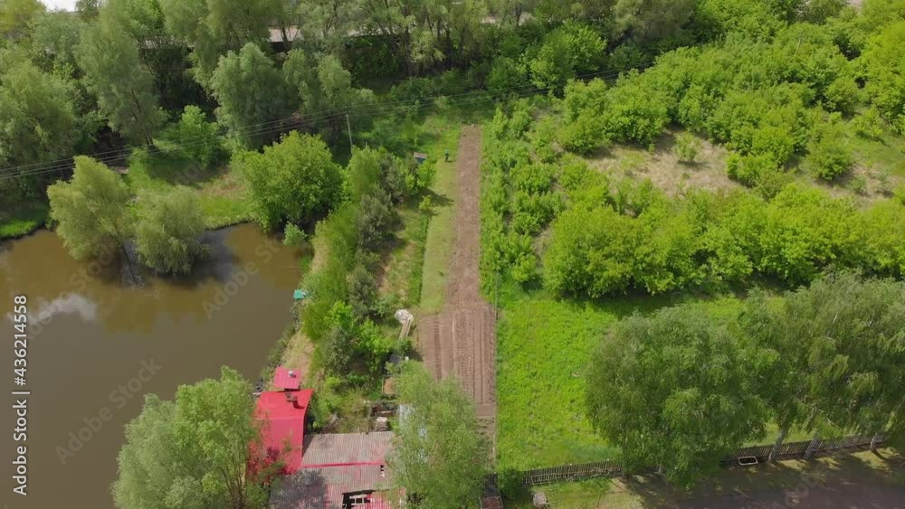 Nature lake houses aerial drone view tilt up camera movement Nature lake houses aerial drone view tilt up camera movement