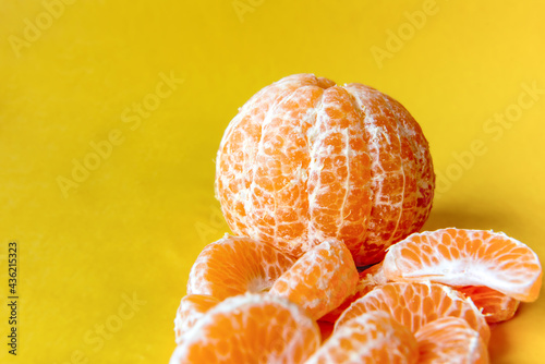 Bergamot mandarin on yellow background.