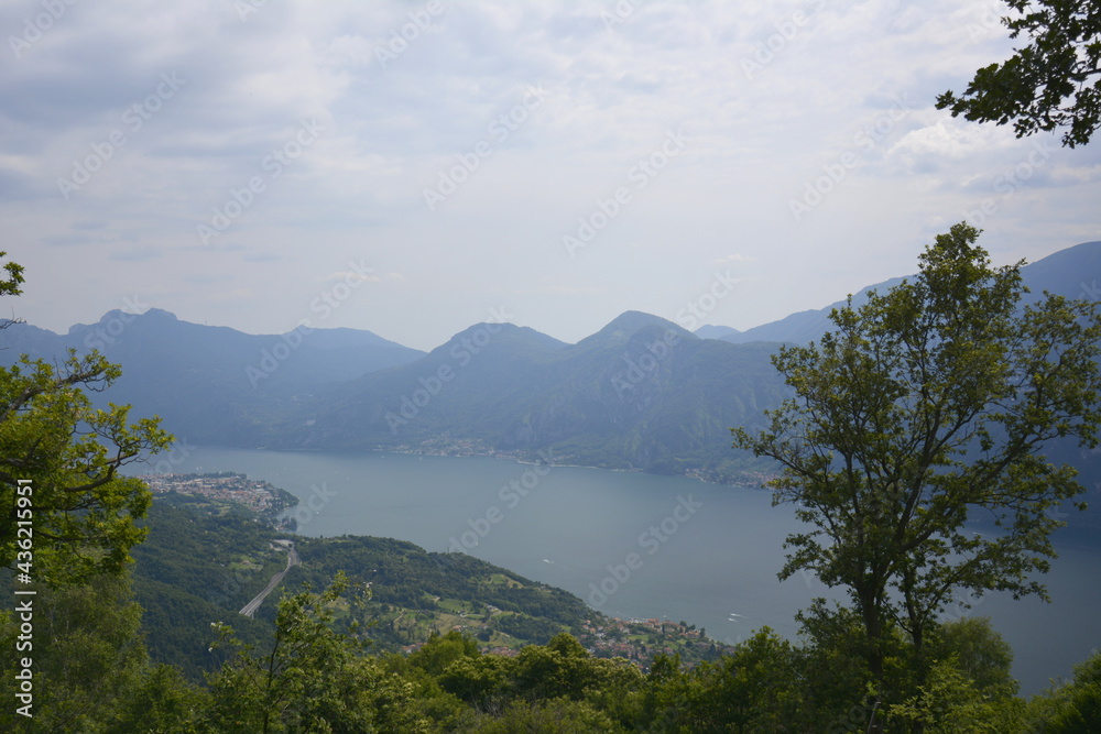 Panorama of mountain lake Como from hiking trail in the hills and mountains
