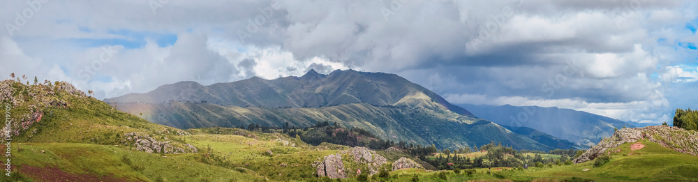 Panoramic view of green fields and beautiful landscape hills of Cusco near Qenqo Archaeological Site. Cusco, Peru, South America