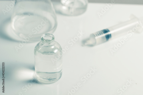 covid-19 vaccine with medical healthcare in laboratory science test glass bottle, coronavirus medicine lab
