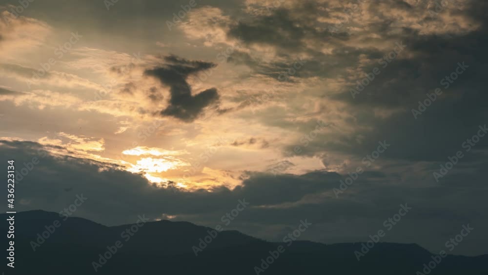 After the storm there must be a calm, Sunset after the storm with a little bird fly over the sky. After the storm there must be a calm, Sunset after the storm with a little bird fly over the sky.