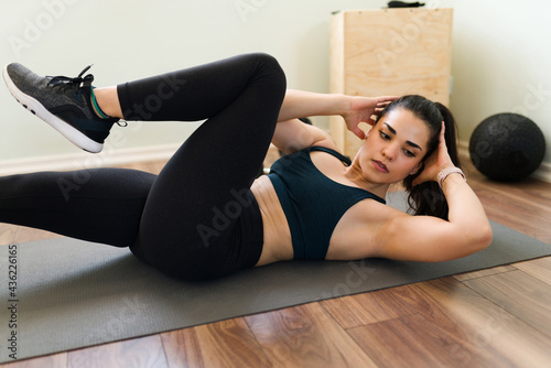 Motivated woman doing cardio exercises