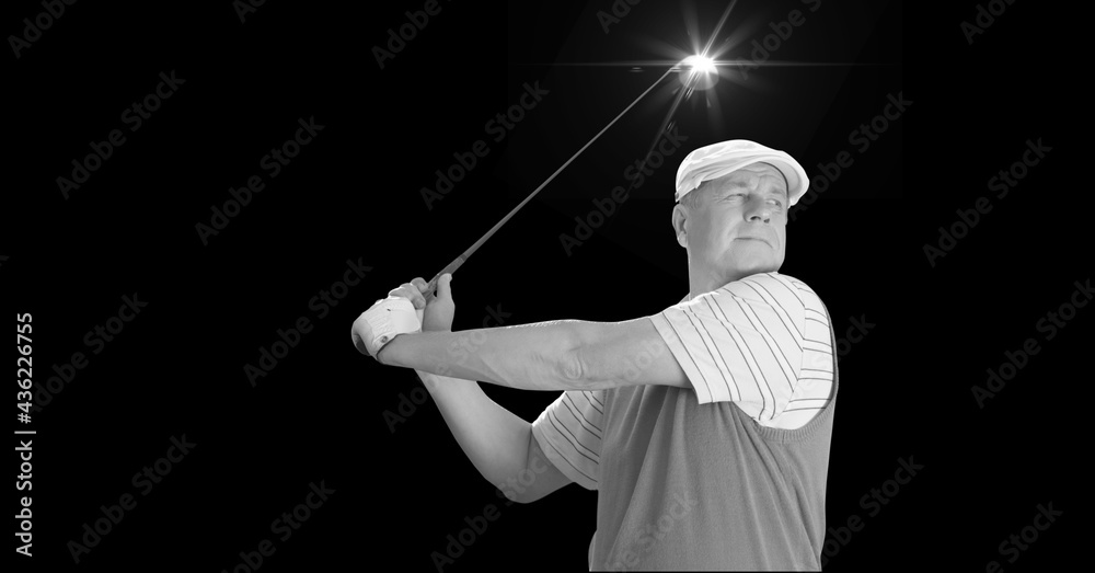 Composition of caucasian male golf player with golf club and copy space in black and white