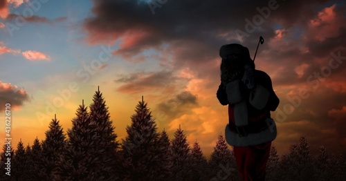 Composition of silhouette of santa claus playing golf over winter landscape