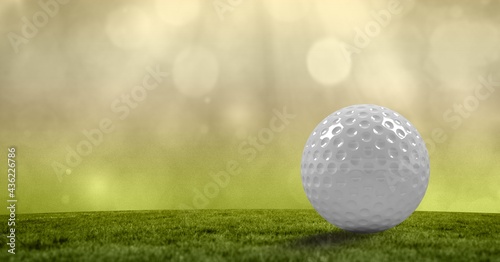 Composition of golf ball in grass, green background and copy space