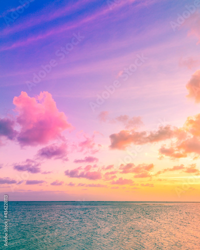 Bright colorful sunset over the ocean © Salty Pineapple