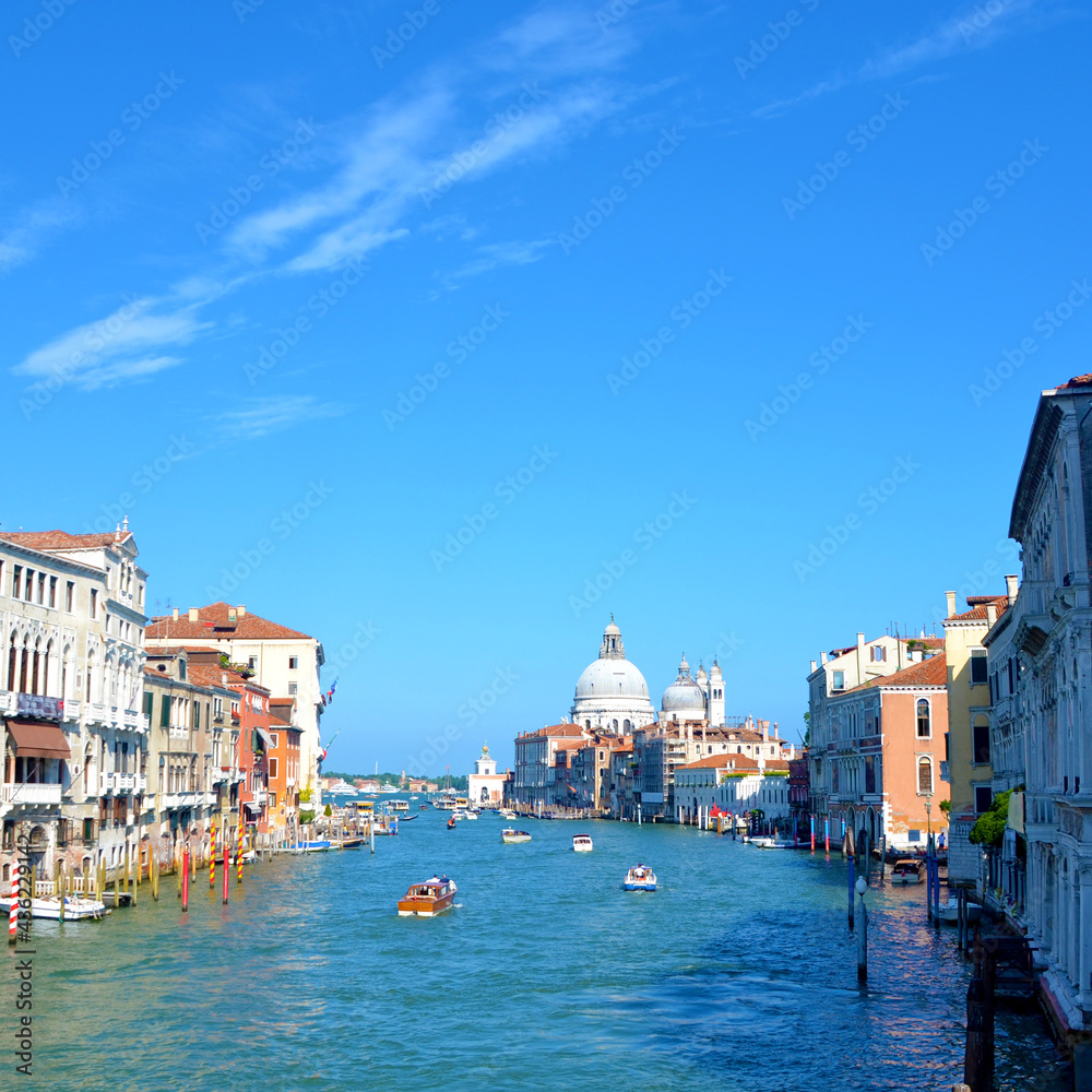 Boats in Venice, Italy with a blue sky background