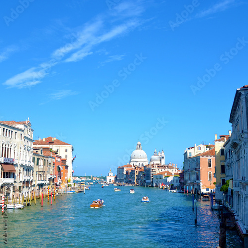 Boats in Venice, Italy with a blue sky background