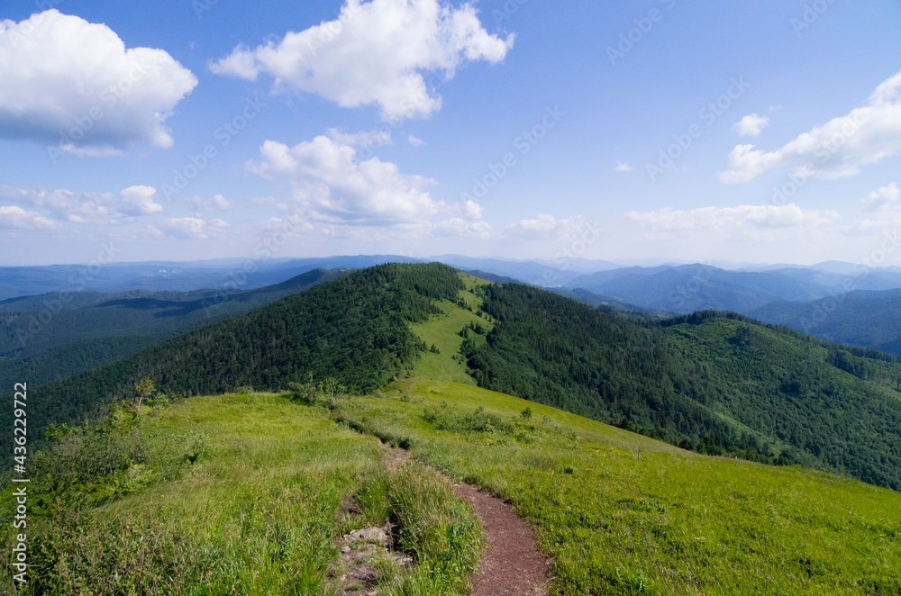 Mountain panoramic landscape with clouds and blue sky Mountain panoramic landscape with clouds and blue sky