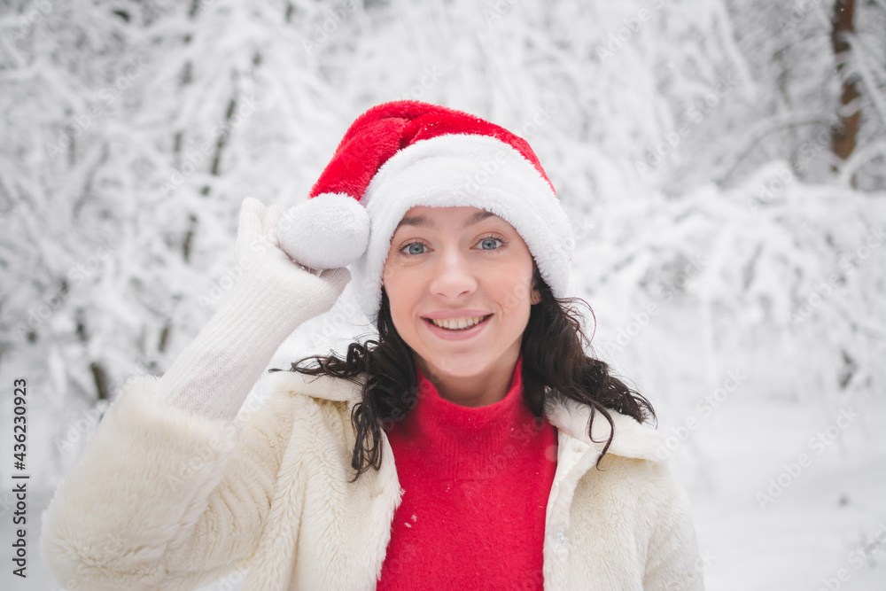Beautiful girl in winter snowy forest in christmas clothes Beautiful girl in winter snowy forest in christmas clothes