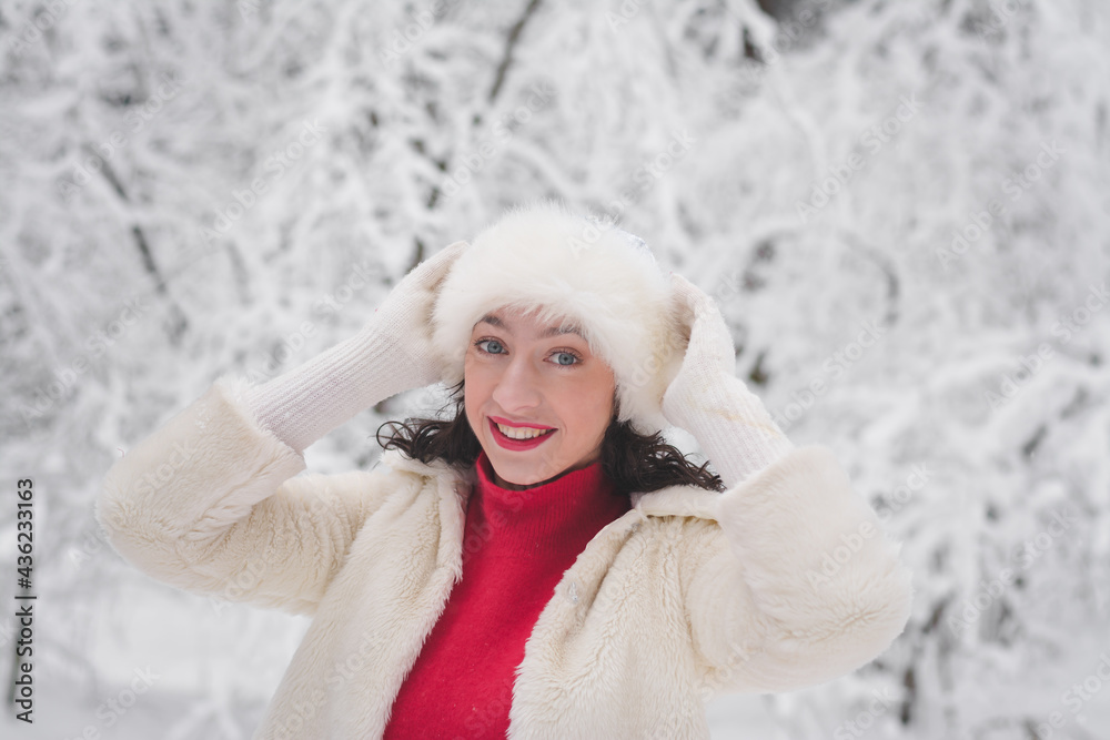 Beautiful girl in winter snowy forest in christmas clothes Beautiful girl in winter snowy forest in christmas clothes