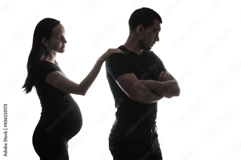 black and white silhouette portrait of man turning away from pregnant woman, unwanted pregnancy