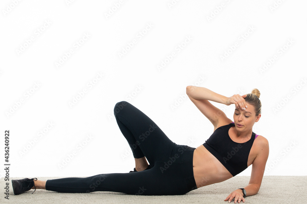 Young woman in sportswear train abs 