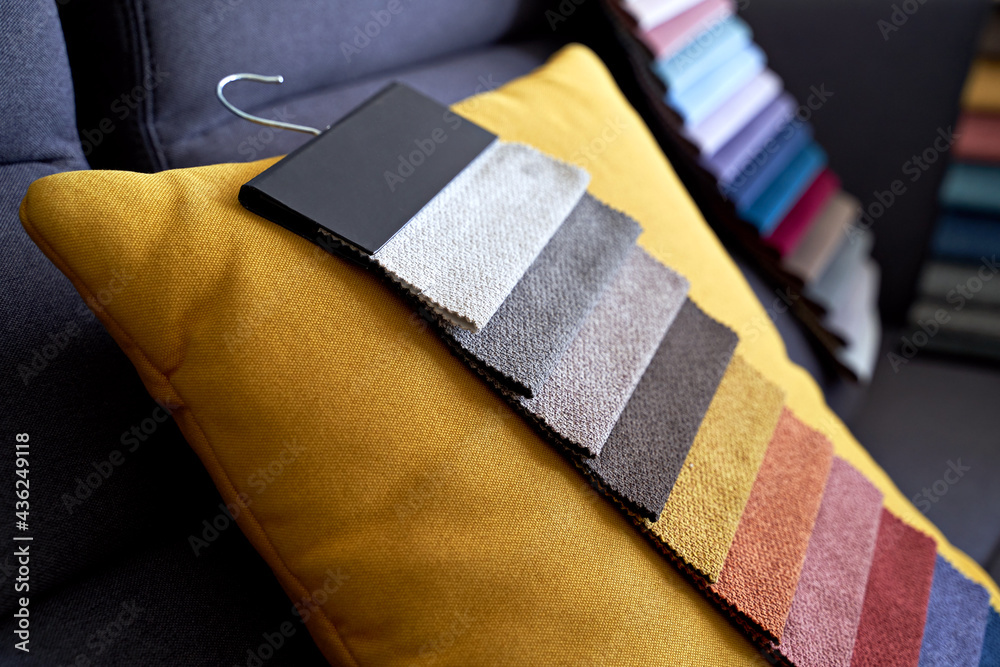 Colorful upholstery fabric samples on the sofa