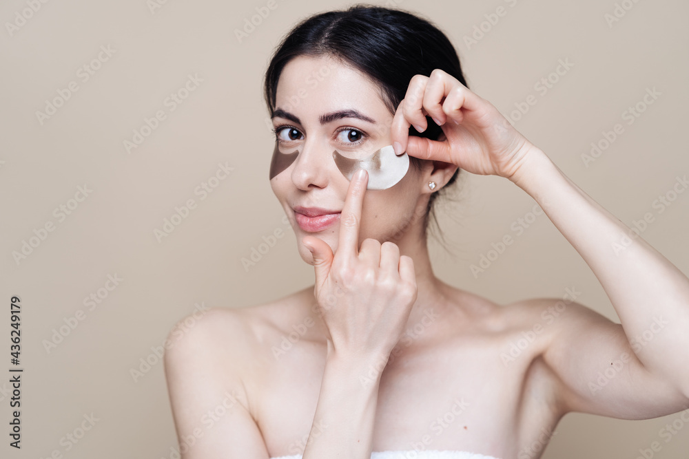 Eye patch, Beautiful Woman With Natural skin And Green Hydro Gel Eye Patches under her eyes. Caucasian woman use patches after shower, skin care