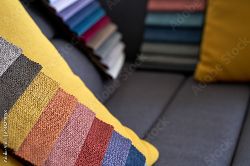 Obraz na płótnie Colorful upholstery fabric samples on the sofa w salonie