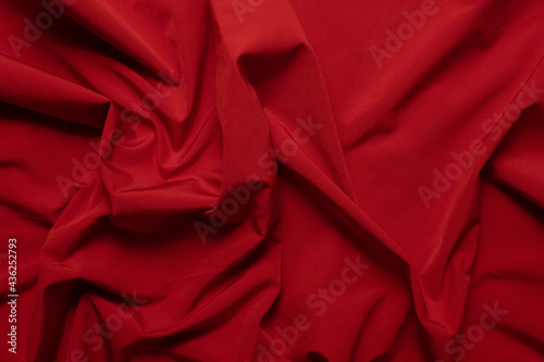 Texture of wrinkled, crumpled red fabric close-up. background for your mockup