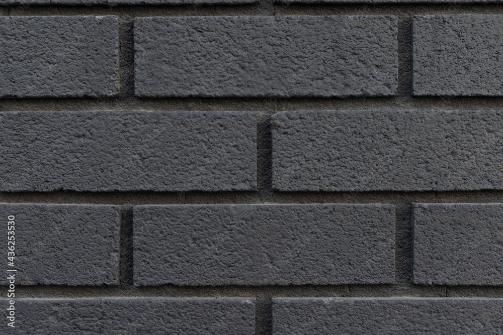 Black brick wall texture background close-up. Black brick wall texture background close-up.