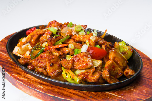 Asian beef and vegetables in a spicy sauce at a Korean restaurant. White background.........