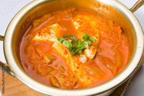 Asian tofu in a spicy kimchi sauce at a Korean restaurant. White background..........