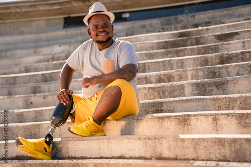 portrait of black man with prosthetic leg . photo