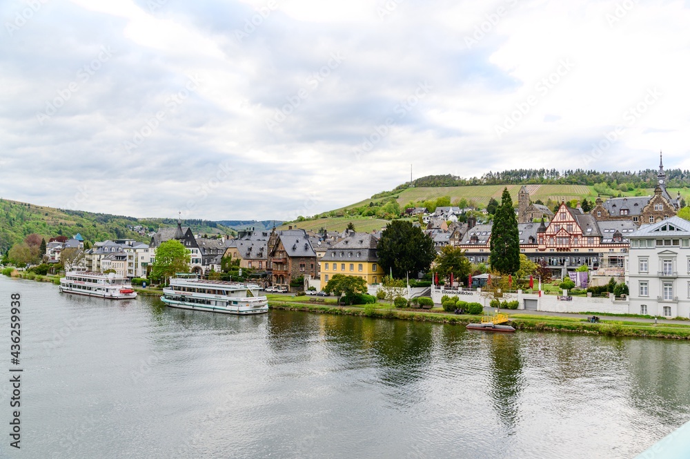 Panorama view on Traben-Trarbach am Mosel. Beautiful historical town on the loop of romantic Moselle river. Ship, church, hill. Rhineland-Palatinate, Germany