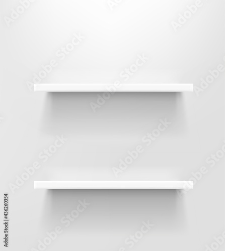 Two white shelves on white wall