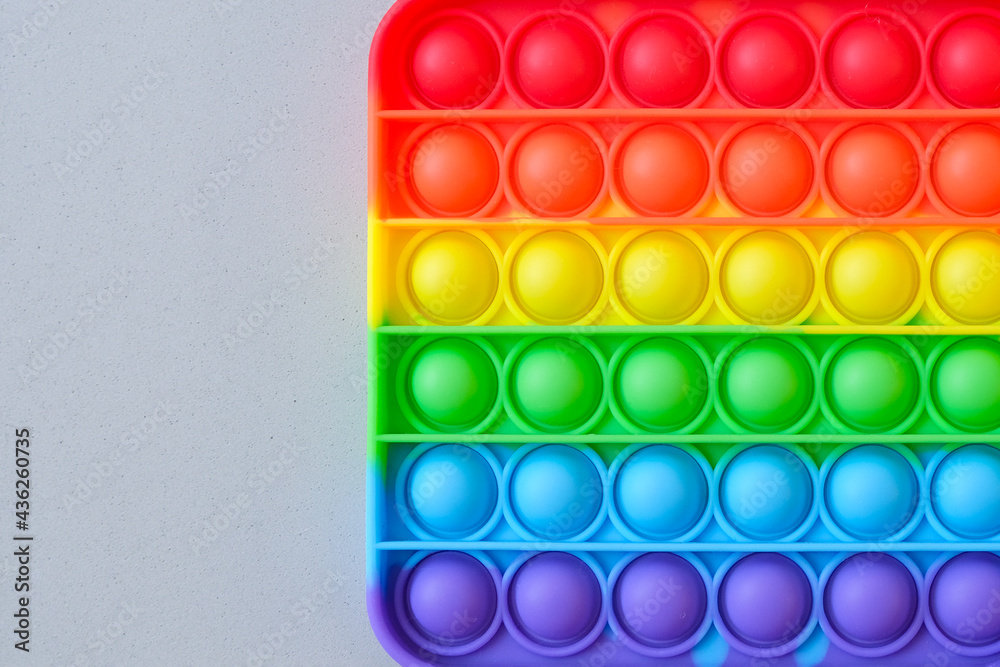 Rainbow pop it toy fidget on a background Rainbow pop it toy fidget on a background