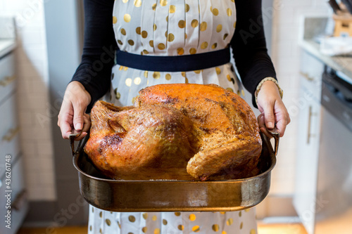 Woman with Thanksgiving turkey 