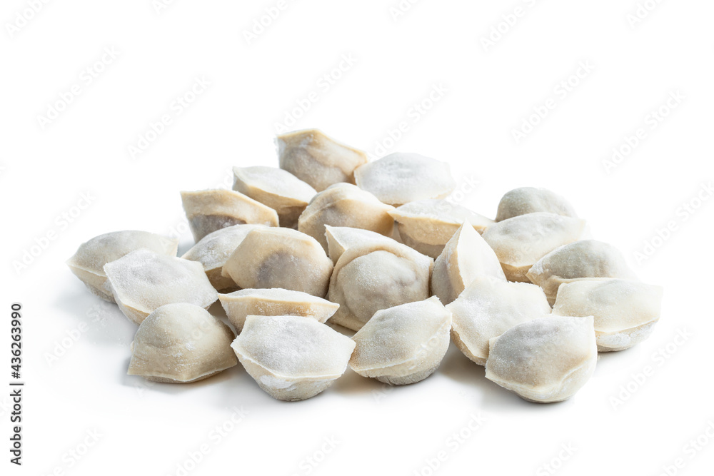 Pelmeni - dumplings of Russian cuisine with minced meat filling wrapped in thin unleavened dough isolated on white Pelmeni - dumplings of Russian cuisine with minced meat filling wrapped in thin unleavened dough isolated on white