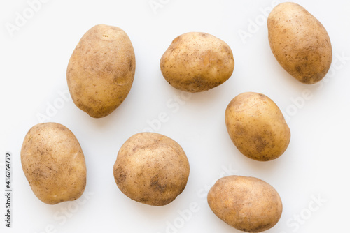 young potatoes on a white plate, potatoes on a white plate  photo