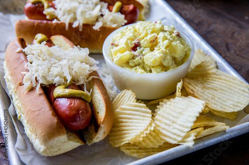 Hot Dog with sauerkraut and chips photo