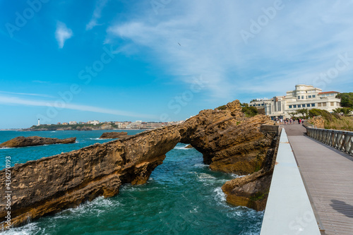 Wooden bridge together to Plage du Port Vieux in Biarritz, holiday in south-eastern France. Biarritz, department of Pyrenees-Atlantiques