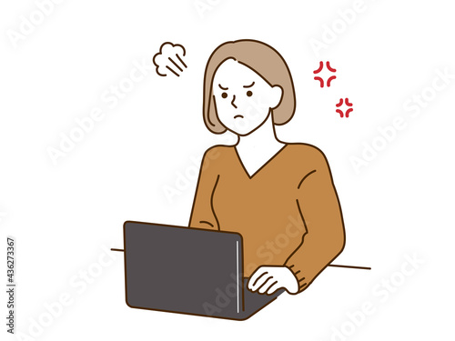 PC作業中に怒る女性