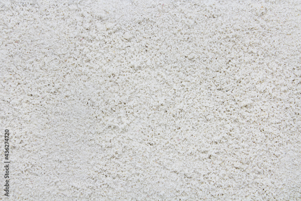 Fototapeta premium Sand texture, white sandy beach background.
