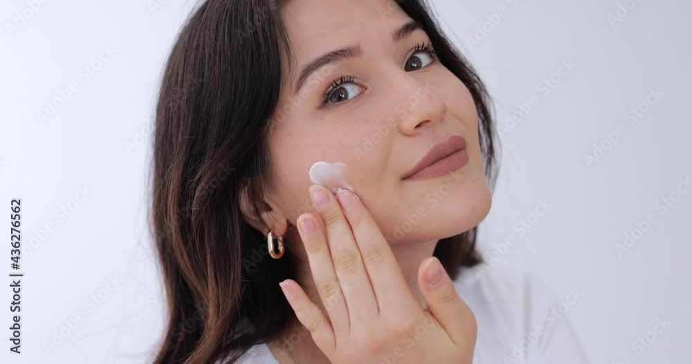 beautiful woman looking her skin at the mirror beautiful woman looking her skin at the mirror