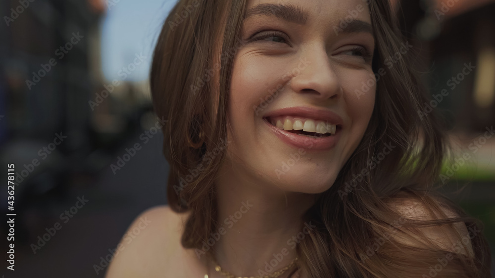 close up of happy young woman smiling outside. close up of happy young woman smiling outside.
