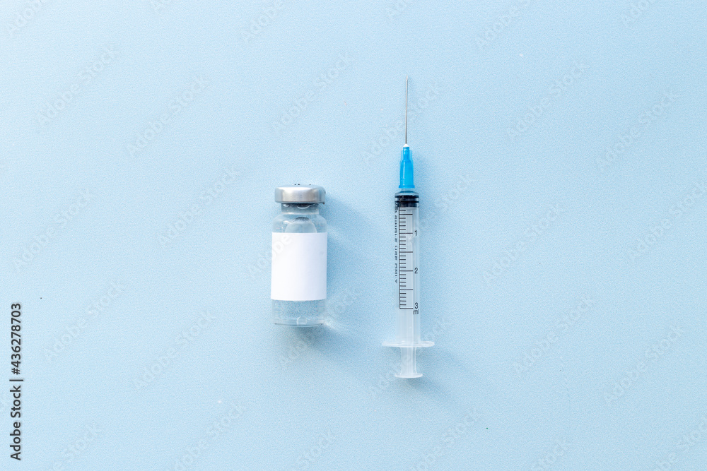 Medical glass vial vaccine and syringe. Vaccination concept Medical glass vial vaccine and syringe. Vaccination concept