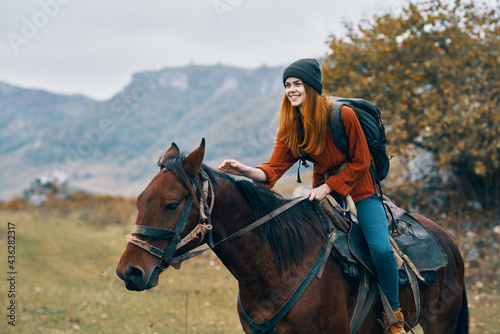 cheerful woman Tourist riding a horse nature mountains joy © SHOTPRIME STUDIO