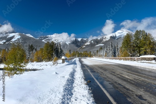 Road covered with first snow to mountain ski resort in Canadian Rockies. Kananaskis Village. Nakiska. Alberta. Canada 