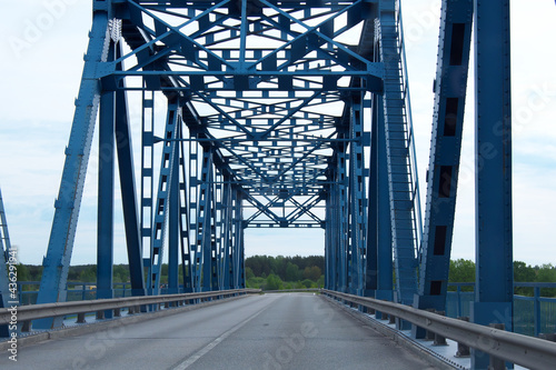 Steel bridge in blue. Photo inside the bridge.