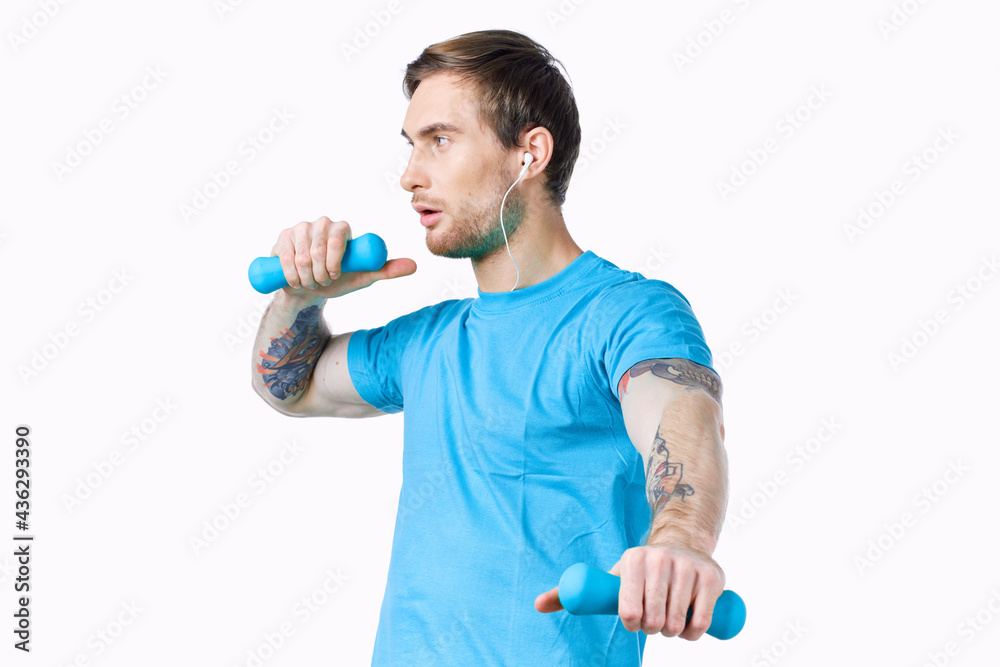 man with dumbbells in hands workout exercise fitness blue background man with dumbbells in hands workout exercise fitness blue background