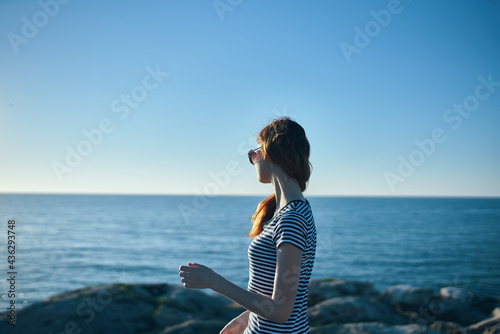 tourism travel mountains landscape woman on the beach near the sea sunset