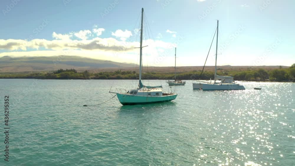 Aerial Panning Shot Of Nautical Vessels Moored In Sea During Sunset Against Cloudy Sky - Big Island, Hi Aerial Panning Shot Of Nautical Vessels Moored In Sea During Sunset Against Cloudy Sky - Big Island, Hi
