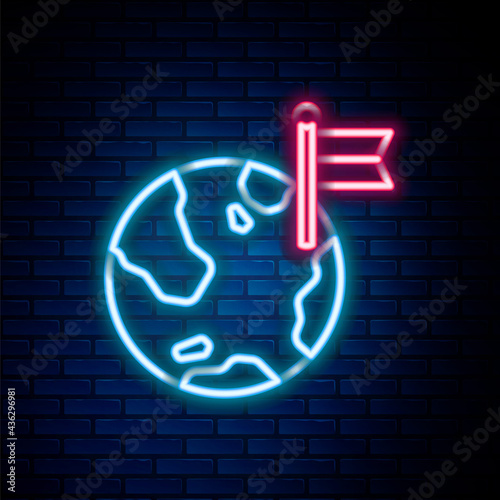 Glowing neon line Planet with flag icon isolated on brick wall background. Victory, winning and conquer adversity concept. Colorful outline concept. Vector
