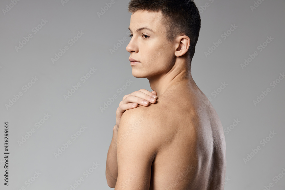 athletic men muscled arm muscles naked back gray background model back view athletic men muscled arm muscles naked back gray background model back view
