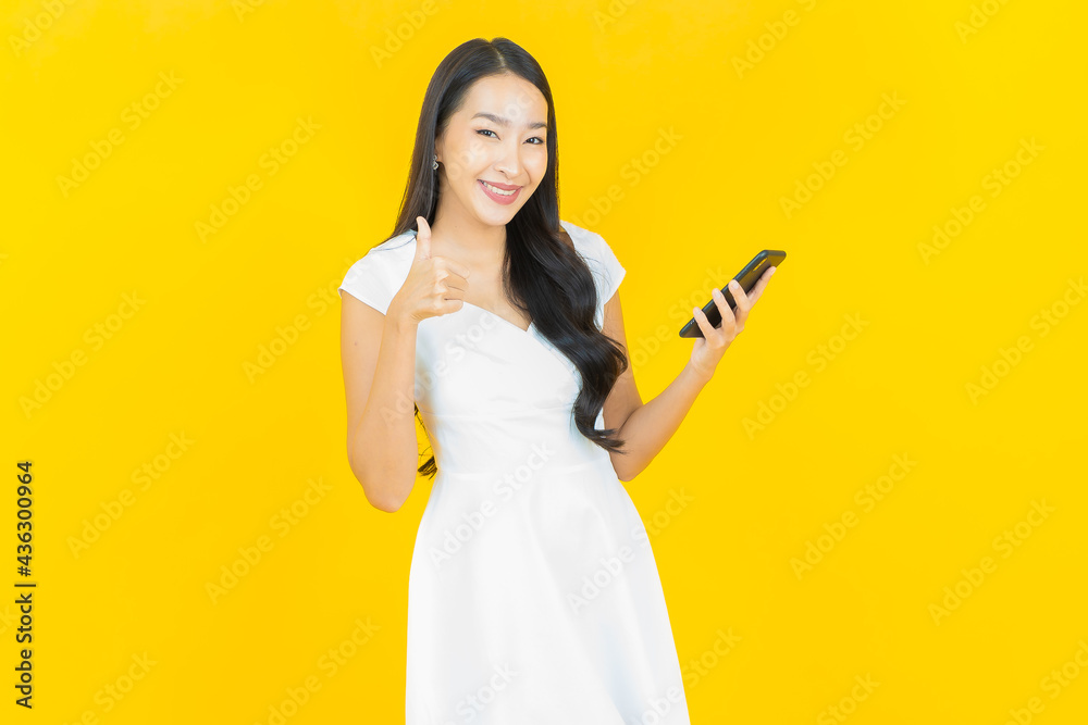 Portrait beautiful young asian woman smile with smart mobile phone Portrait beautiful young asian woman smile with smart mobile phone