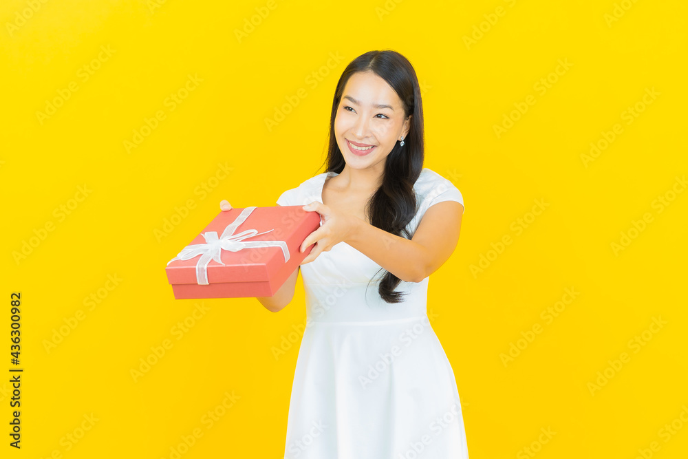 Portrait beautiful young asian woman smile with red gift box Portrait beautiful young asian woman smile with red gift box